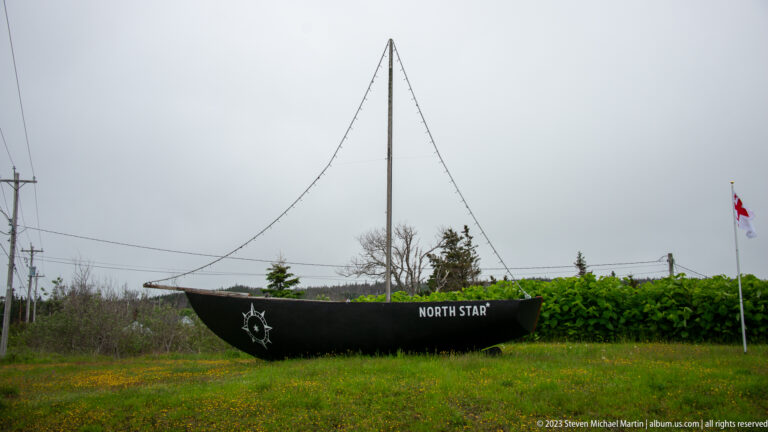 Black boat-shaped display labeled NORTH STAR with mast, rigging lines, compass emblem, and Canadian flag nearby.