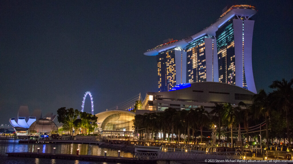 Marina Bay Sands above palms, with the ArtScience Museum and Singapore Flyer visible to the left.