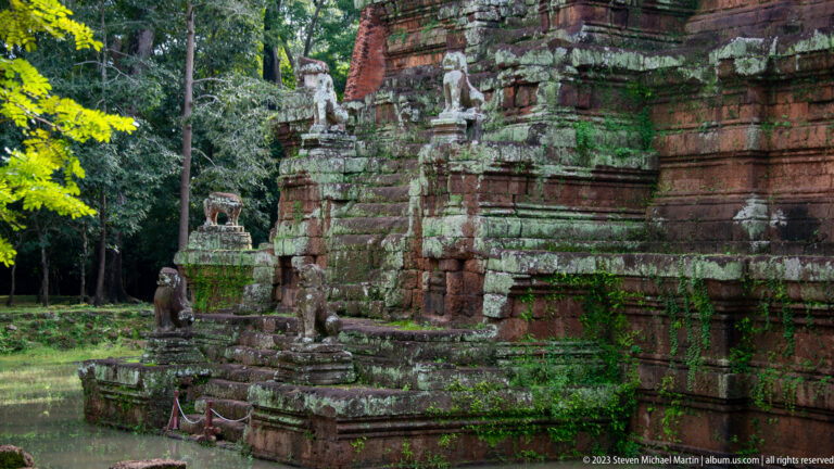 Oblique view of stair and guardian sculptures on Phimeanakas at Angkor Thom.