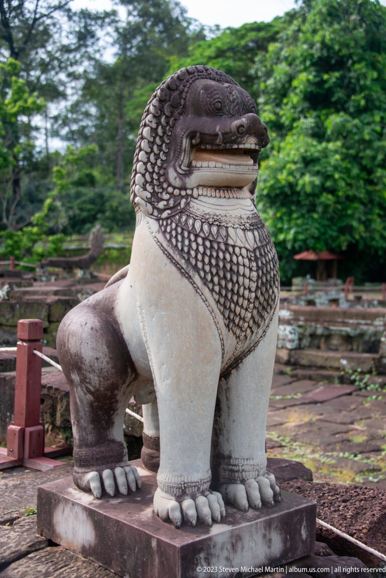 Close torso of a restored or painted guardian lion at Angkor Thom.
