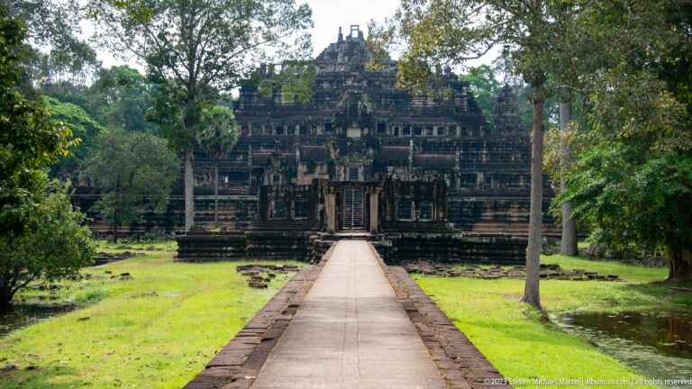 Closer centered causeway view of the stepped Baphuon façade at Angkor Thom.