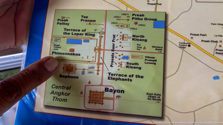Finger pointing to printed visitor map of Angkor Thom at Angkor Thom.