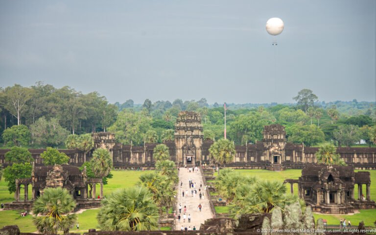 High elevated view down the long central causeway through the Angkor Wat grounds at Angkor Wat.