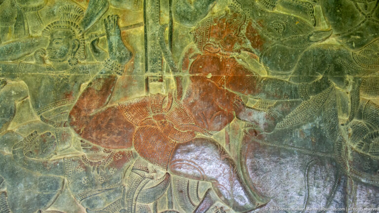 Colored mounted horse and rider in profile at Angkor Wat.