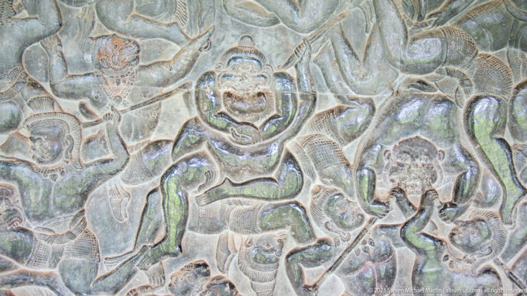 Close relief of an animal or mythical creature surrounded by scrolling foliage at Angkor Wat.