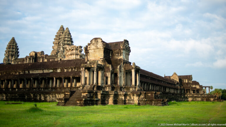 Oblique corner view of projecting pavilion, long gallery, and towers at Angkor Wat.
