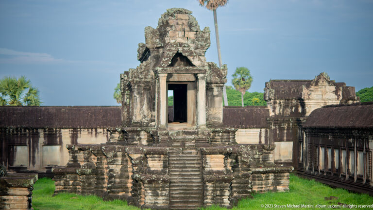 Frontal small shrine or library on a raised platform with central stair at Angkor Wat.