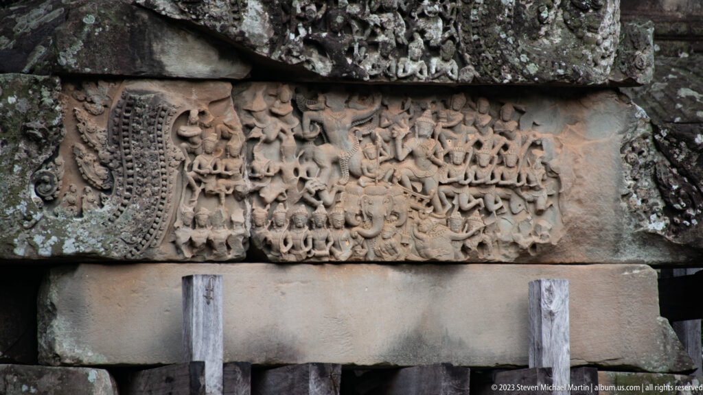 Horizontal sandstone inscription with several lines of carved script at Angkor Wat.