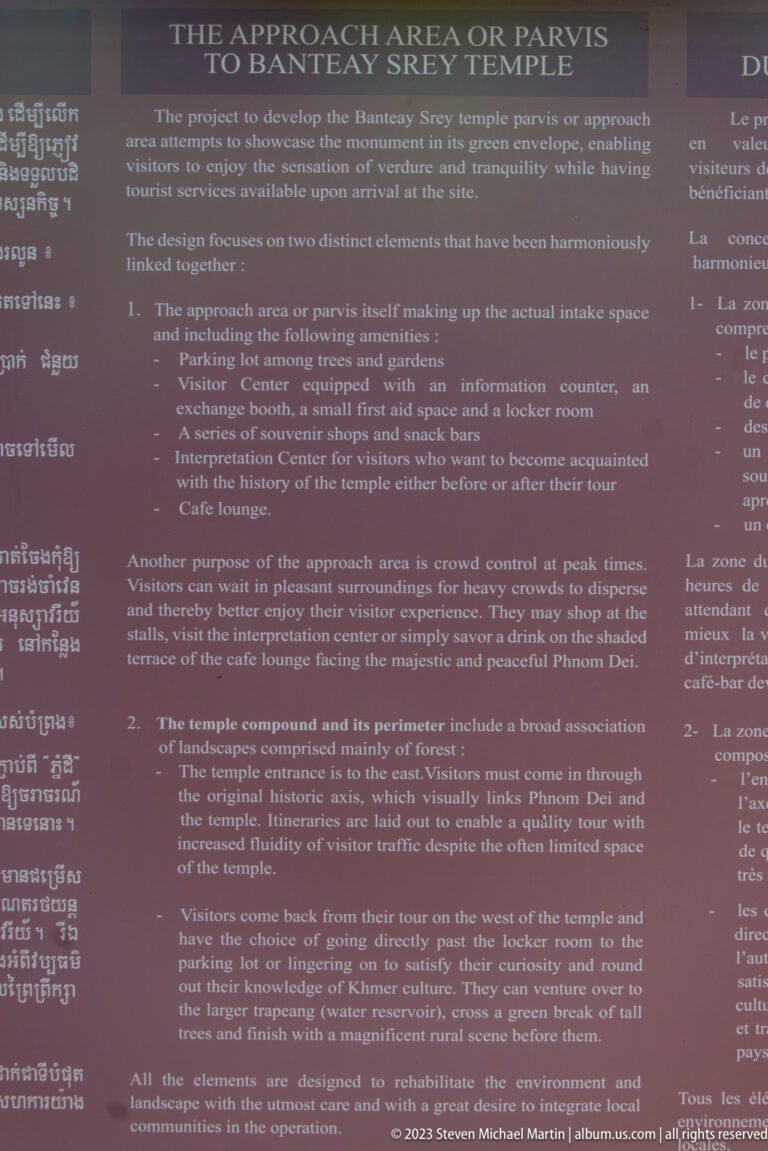 Maroon multilingual panel describing the visitor center, approach area, and temple compound.