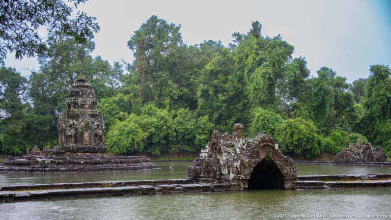 Bridge and sanctuary across surrounding pond.