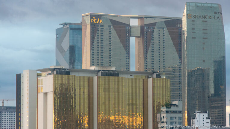 The Peak and Shangri-La high-rise towers rising above lower buildings in Phnom Penh.