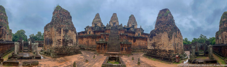 Panoramic view of Pre Rup’s upper terraces with central stairs and numerous brick towers.