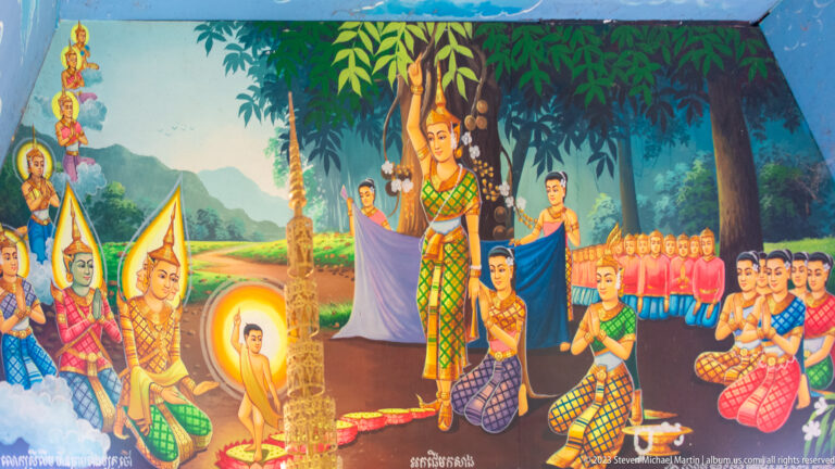 Colorful Buddhist mural with a standing woman, kneeling attendants, monks, and a haloed child.