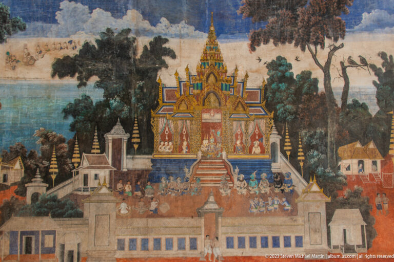 Reamker mural with an ornate elevated temple, broad steps, assembled figures, walls, shrines, and trees.