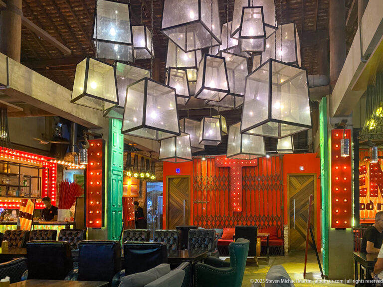 Modern restaurant with suspended lantern-style lights.