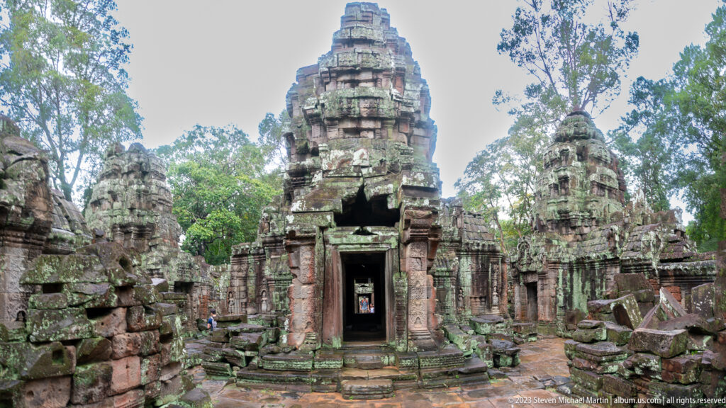 Wide frontal view of clustered sanctuary towers and doorways within Ta Som’s inner complex.