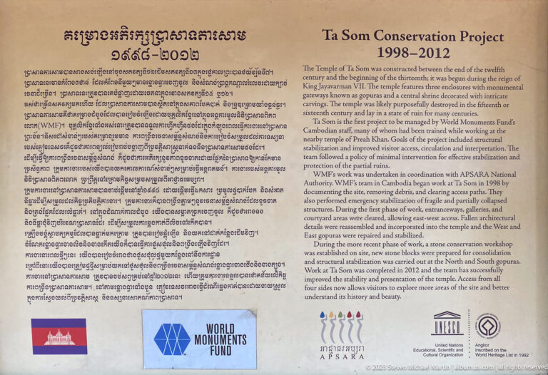 Bilingual Ta Som conservation sign with project dates, explanatory text, and institutional logos.
