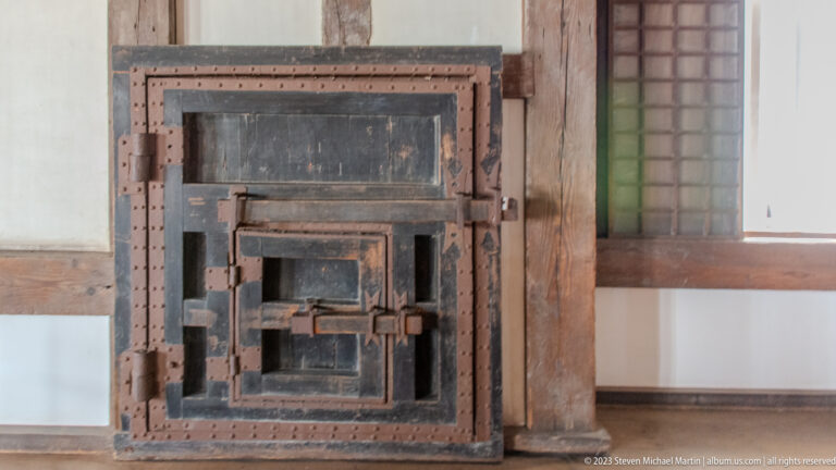 Iron-reinforced square wooden hatch mounted inside Himeji Castle.