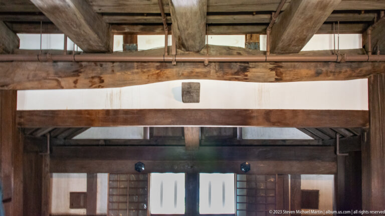 Heavy timber beams and framing inside Himeji Castle.