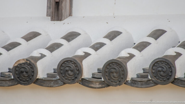 Close-up of decorative roof tiles.
