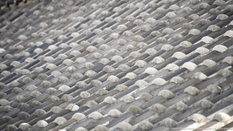 Pattern of gray ceramic roof tiles.