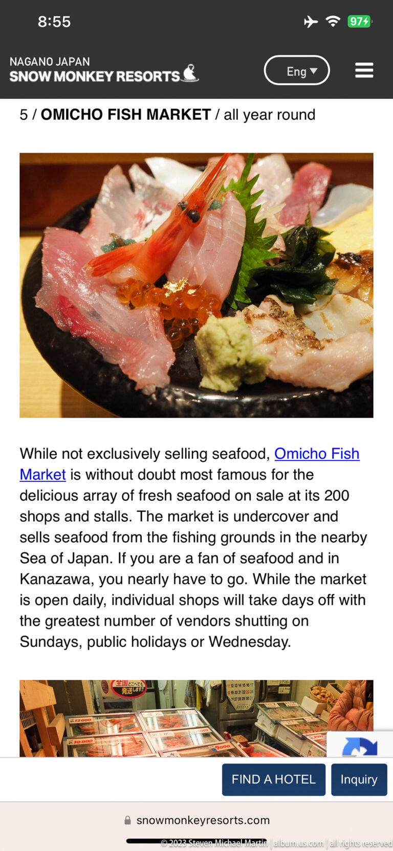 Smartphone screen showing sashimi and a tourism article about Omicho Fish Market.