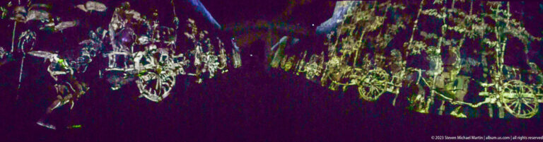 Outlined cart- or carriage-like projections recede along a dark corridor.
