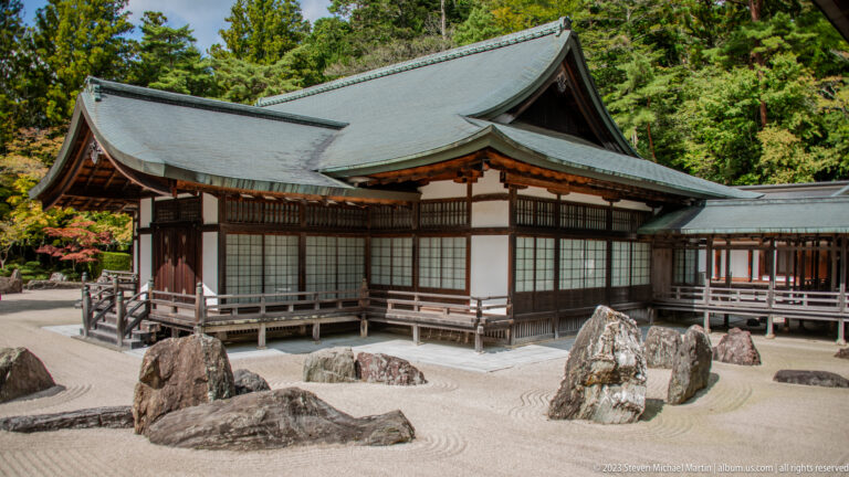 Wide view of Banryūtei rock garden enclosed by dark-timber halls and covered walkways.