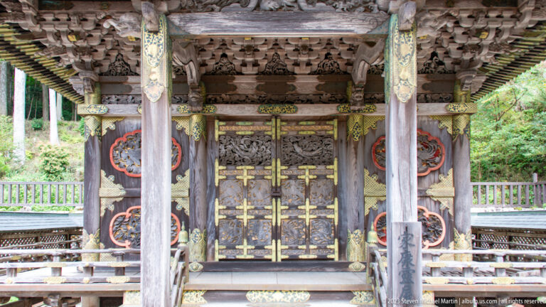 Ornate shrine with carved doors and gilded fittings.