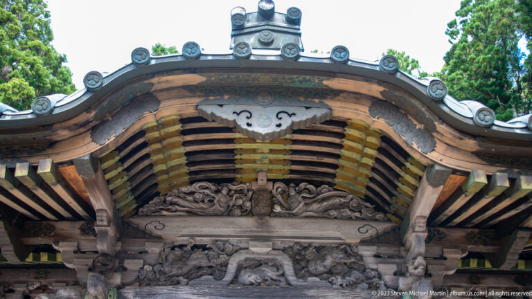 Curved temple gable with carved woodwork.