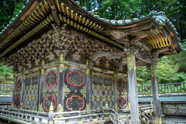 Corner view of richly decorated shrine.