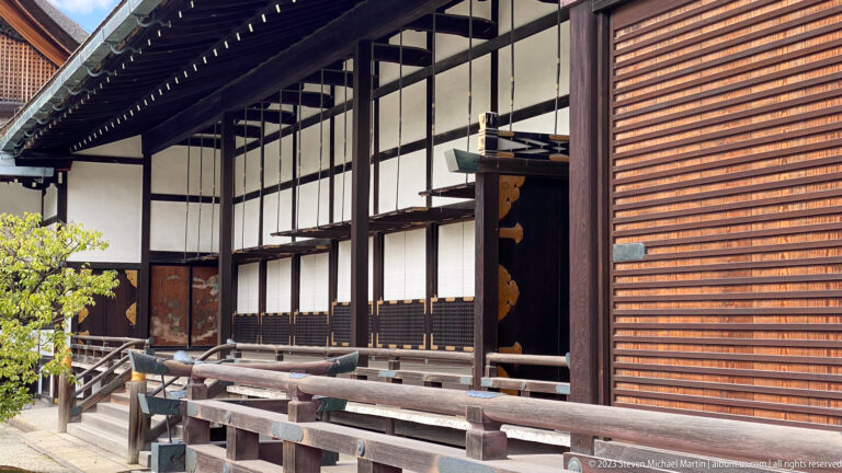 Interior opening with painted panels and polished timber framing.
