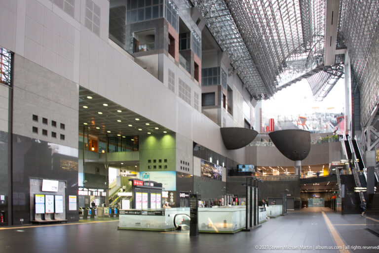 Wide overview of Kyoto Station interior hall.