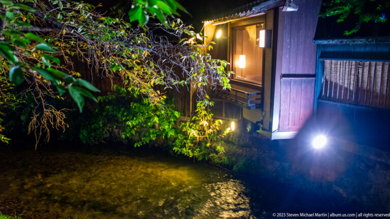 Traditional building beside a narrow canal shown at night with the principal architectural, landscape, or street details visible in the composition.