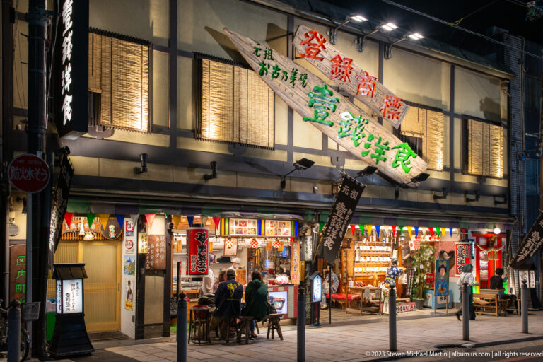 Traditional market and souvenir shop shown at night with the principal architectural, landscape, or street details visible in the composition.