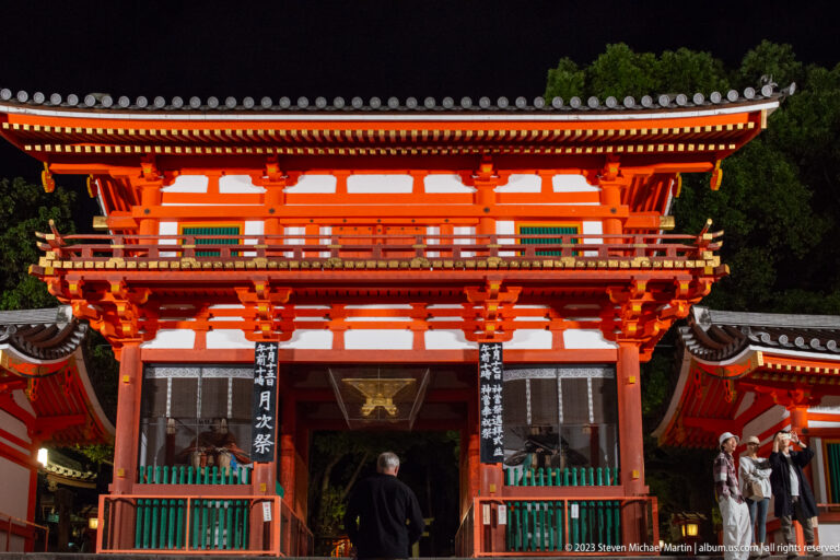 Close frontal view of Yasaka Shrine gate shown at night with the principal architectural, landscape, or street details visible in the composition.