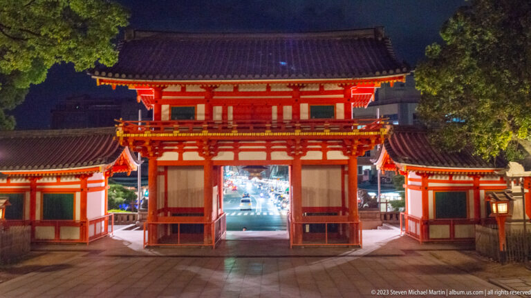 Rear view of Yasaka Shrine gate shown at night with the principal architectural, landscape, or street details visible in the composition.