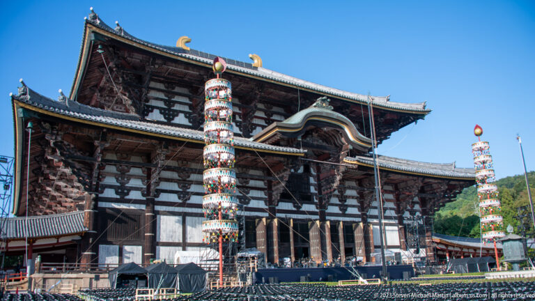 Colorfully decorated ceremonial column standing before Todai-ji’s dark timber Great Buddha Hall.
