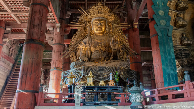 Large gilded crowned bodhisattva seated on a lotus pedestal inside Todai-ji’s Great Buddha Hall.