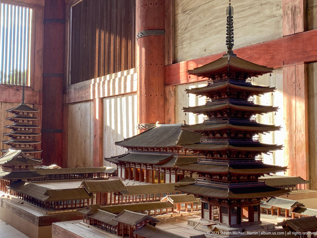 Detailed scale models of pagodas, corridors, gates, and temple halls displayed inside Todai-ji.