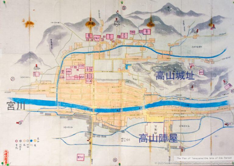 Historic illustrated map of Takayama showing rivers, streets, mountain ridges, Takayama Jinya, and the former castle site.