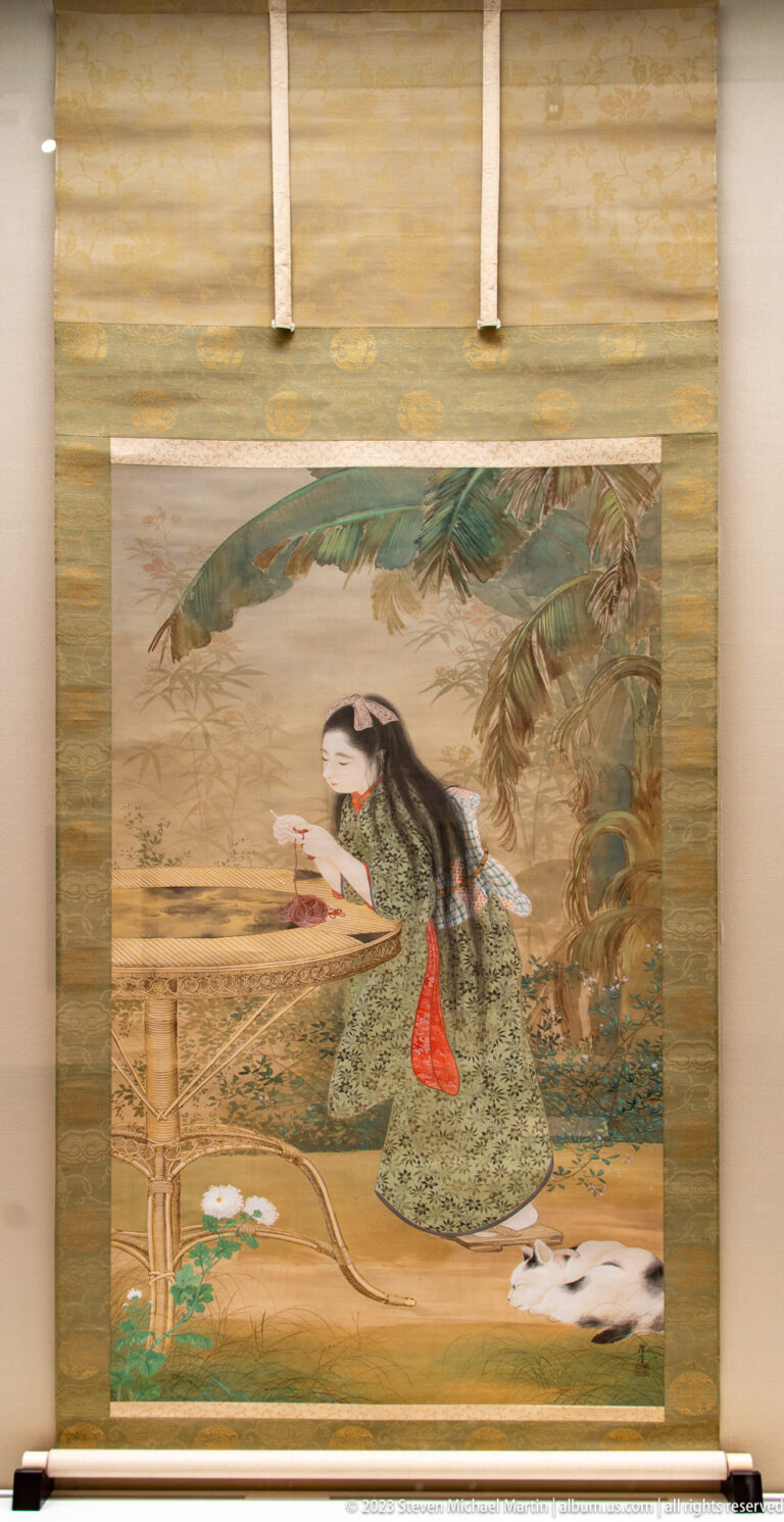 Painted woman in patterned robes reading beneath foliage with small animals near her feet.
