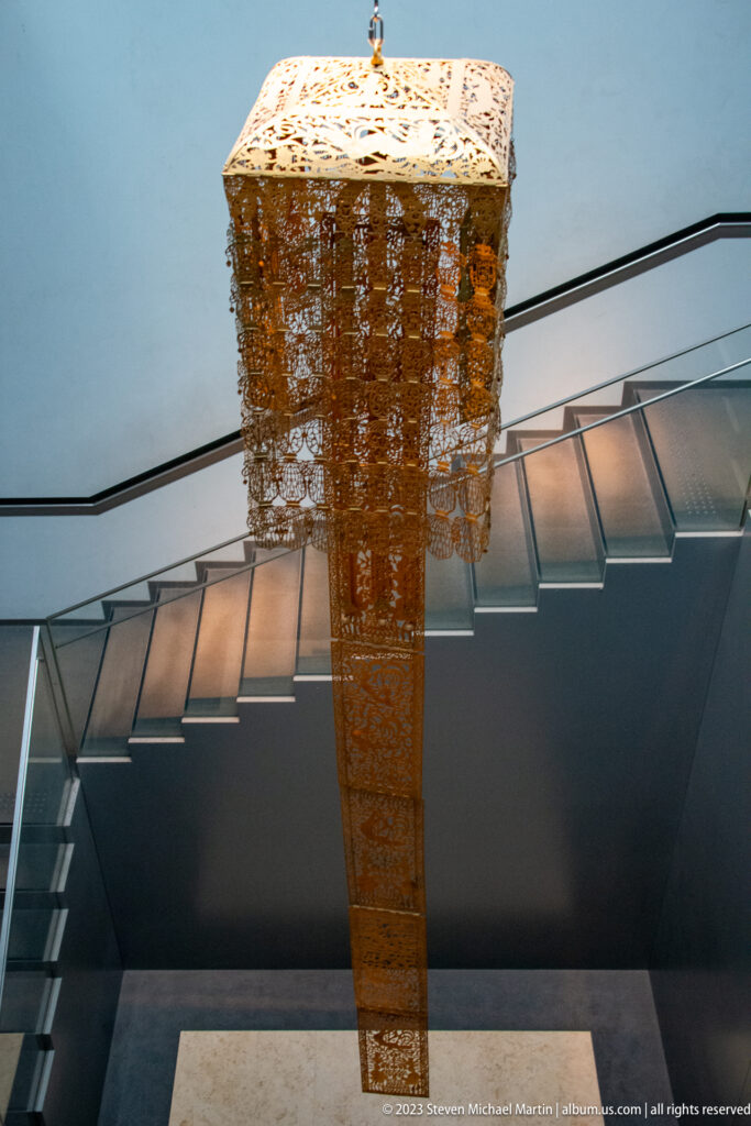 Side view of the Kanjō-ban’s square canopy, pendants, and tapering gilt-bronze openwork.