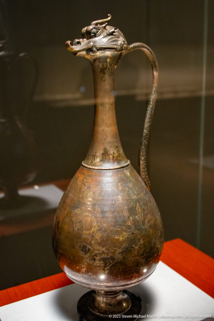 Seventh-century Dragon-Headed Ewer with bulbous body, long neck, dragon spout, and curved handle.