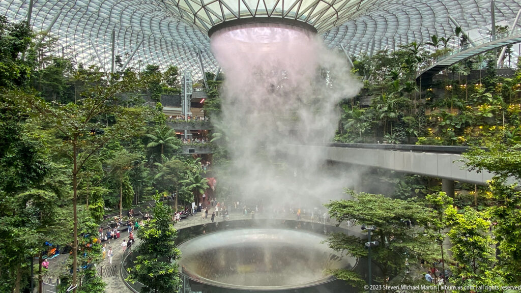 Rain Vortex releasing a dense plume of mist above its circular basin.