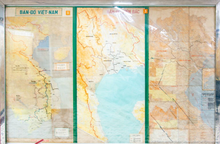 Three large wall maps showing Vietnam and nearby regions with routes, boundaries, and marked areas.