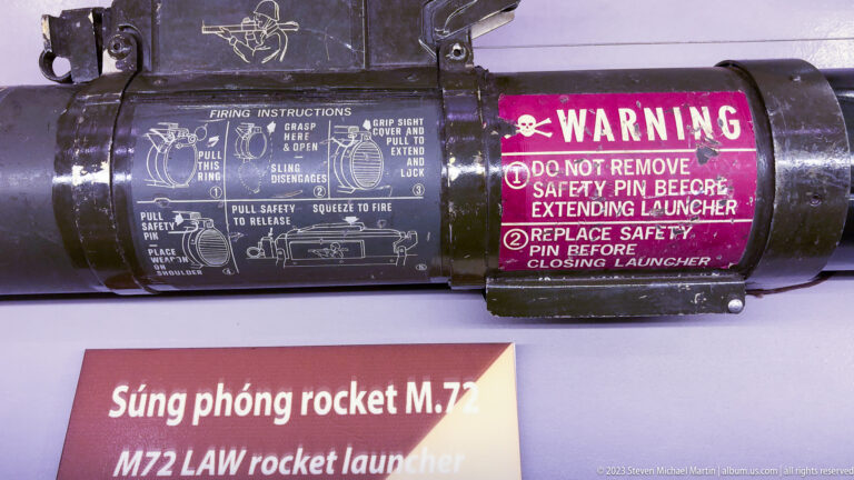 Close view of an M72 LAW rocket launcher with firing instructions and warning label.