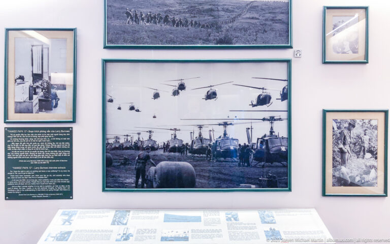 Large black-and-white photograph of many helicopters surrounded by smaller archival images.