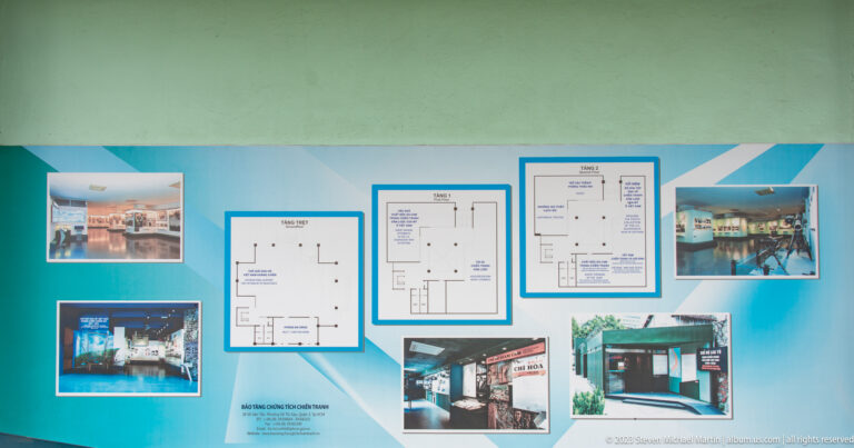 Blue museum orientation board with floor plans and interior photographs.