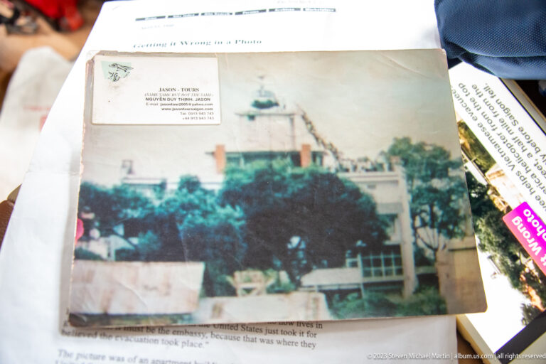Printed article with a historical building photograph and surrounding text.